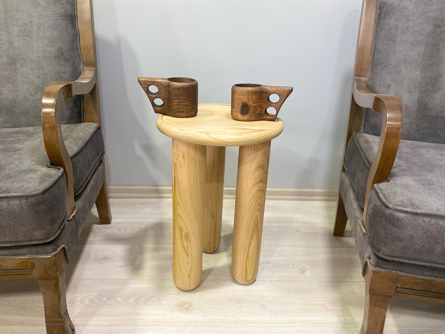 Handcrafted solid chestnut wood coffee table with round top and tapered wood legs