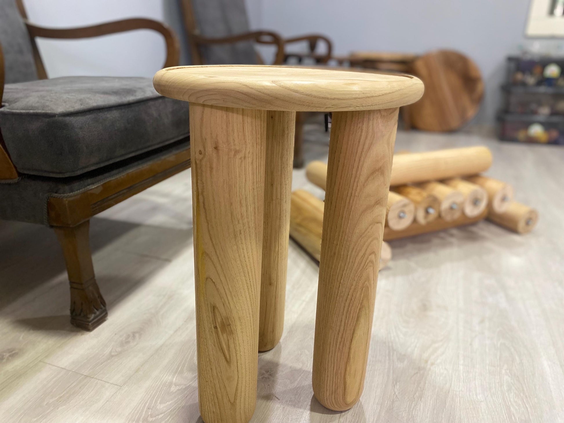 Handcrafted solid chestnut wood coffee table with round top and tapered wood legs