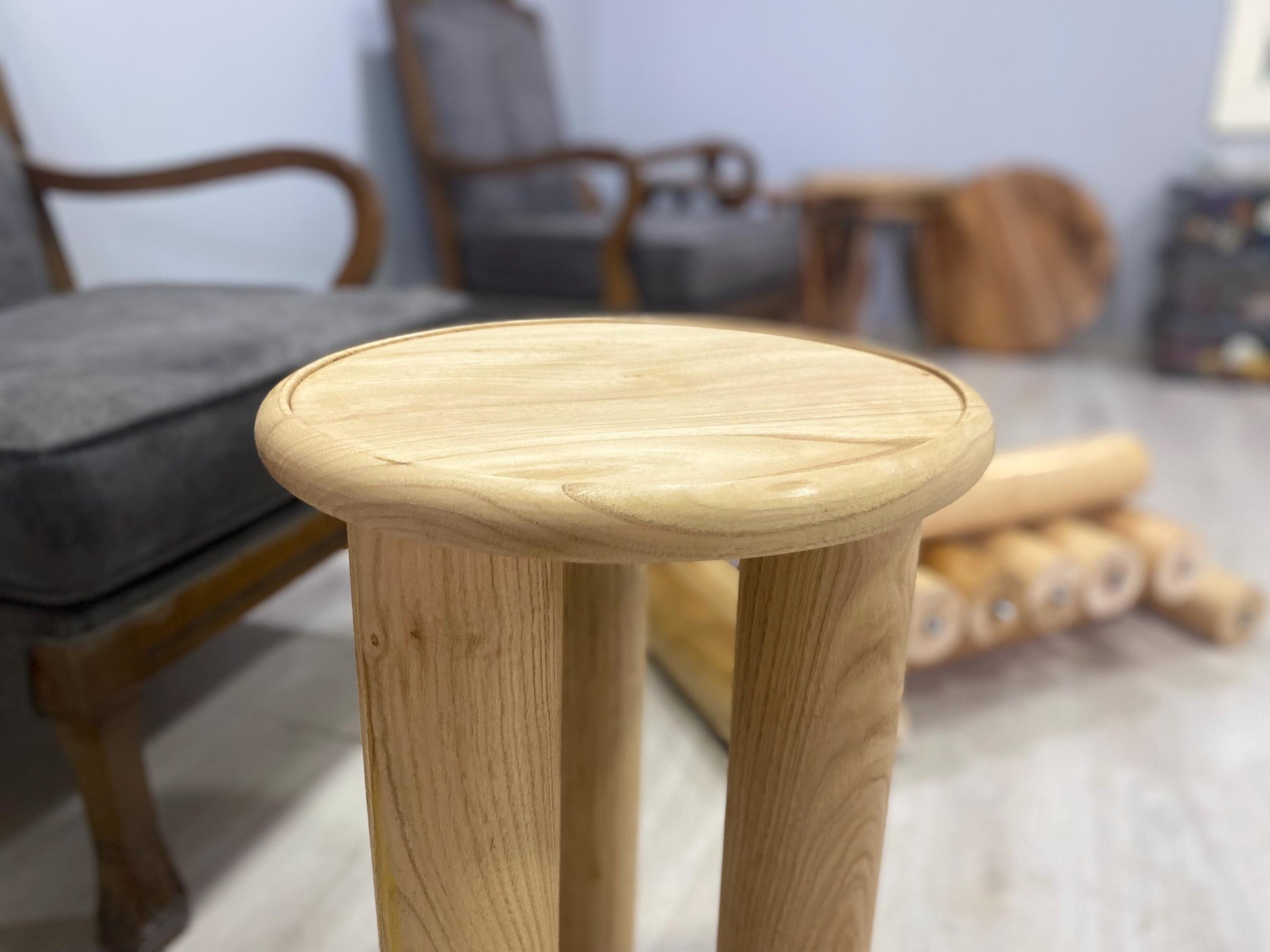 Handcrafted solid chestnut wood coffee table with round top and tapered wood legs