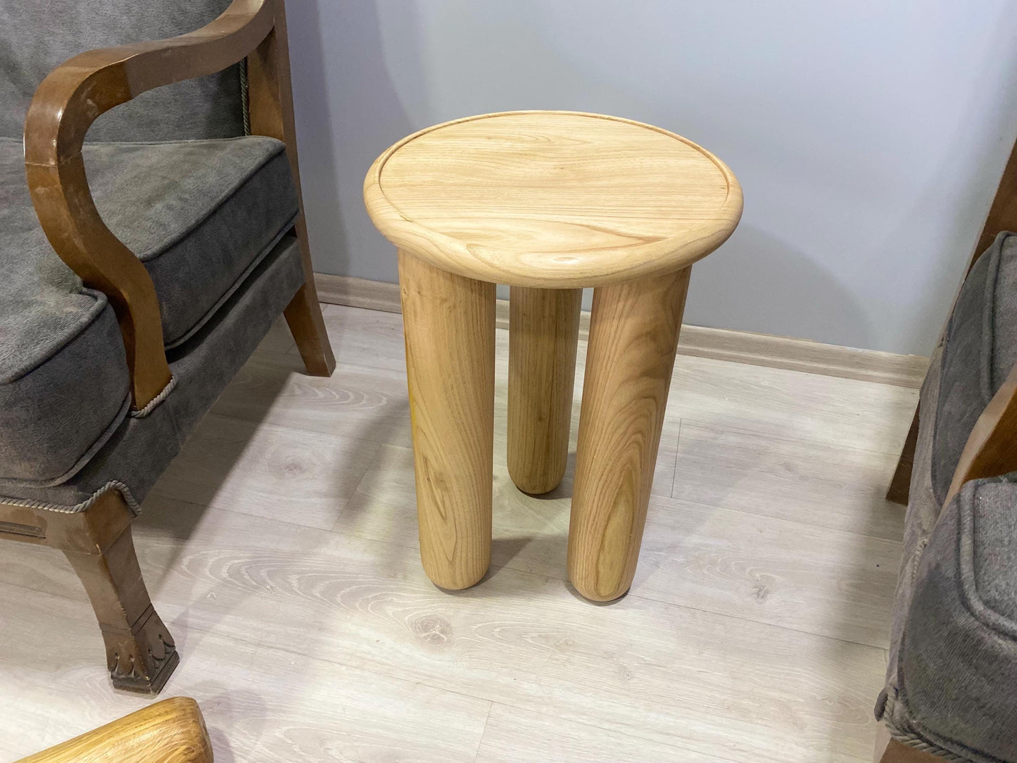Handcrafted solid chestnut wood coffee table with round top and tapered wood legs