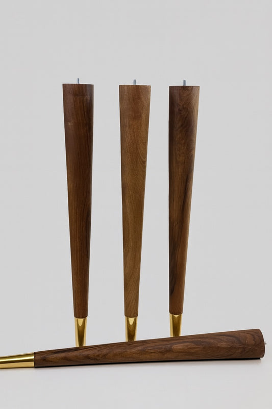 Set of four tapered walnut furniture legs with brass coated cups